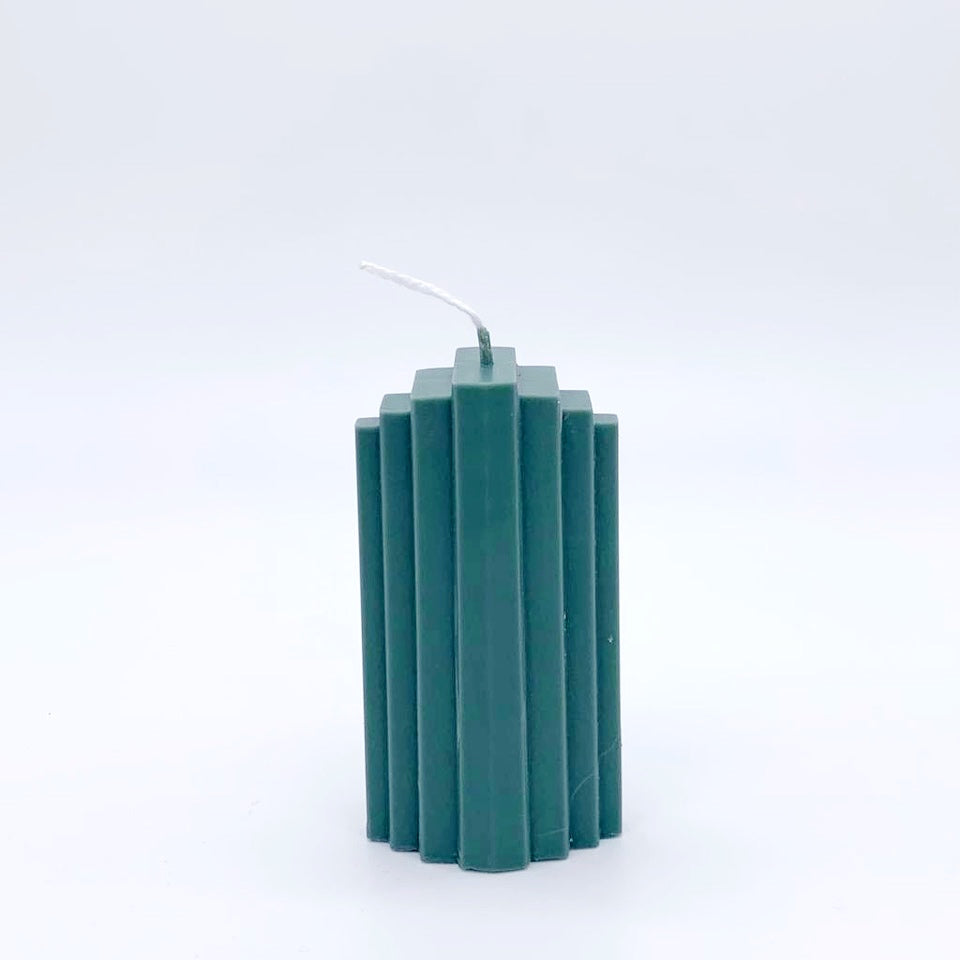 Peggy statement candle in forest green Beatrice's Bedroom
