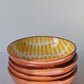 Terracotta bowl in ray, dash and stripe designs