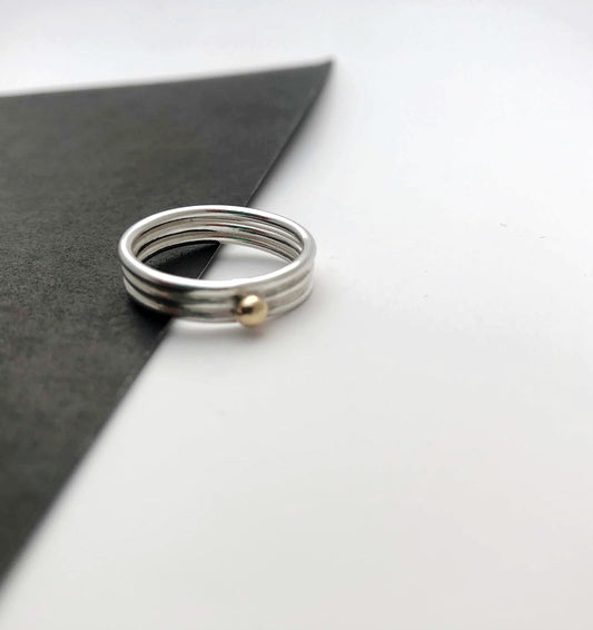 'Neo Deco' triple silver band with 9ct gold bead - Plum & Belle